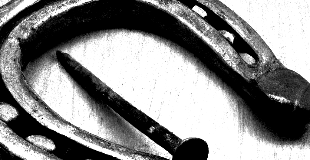 DALL·E-2023-12-27-15.52.04-a-nail-and-a-horseshoe2
